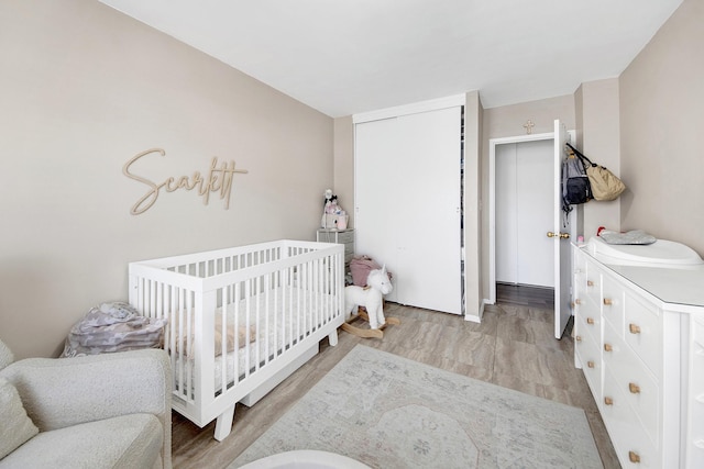 3130 Irwin Ave Unit 2C, Bronx, NY 10463 - bedroom with wood finished floors, a closet, and a nursery area