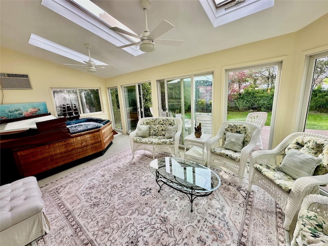 sunroom / solarium with a wall mounted air conditioner and vaulted ceiling with skylight
