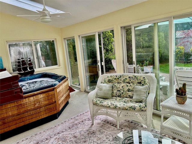 sunroom featuring lofted ceiling, carpet, and a jacuzzi