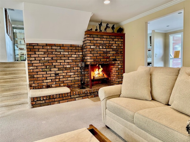 living room with visible vents, carpet flooring, ornamental molding, and a brick fireplace