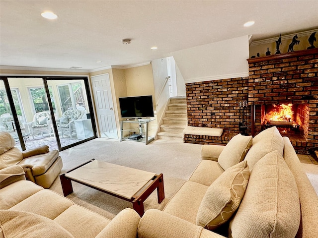 living room featuring recessed lighting, ornamental molding, a fireplace, and carpet