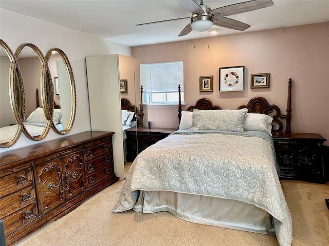 bedroom with ceiling fan and carpet