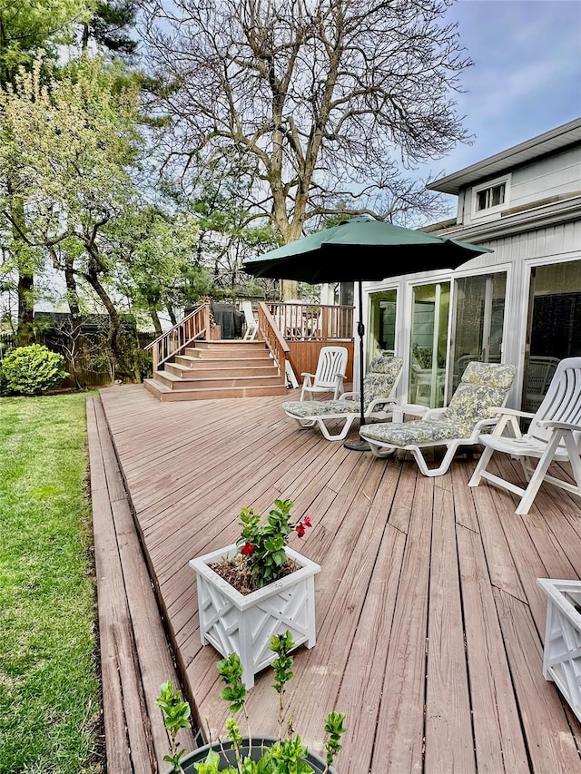 wooden deck featuring fence and stairs
