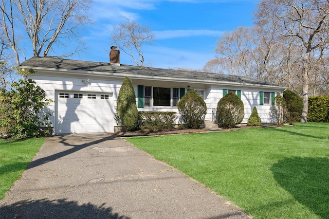 single story home featuring driveway, a front lawn, a chimney, and an attached garage