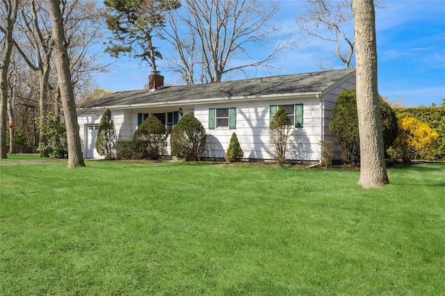 single story home featuring a chimney, a shingled roof, a front lawn, and a garage