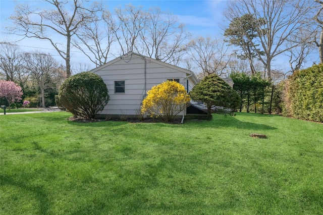 view of home's exterior with a lawn
