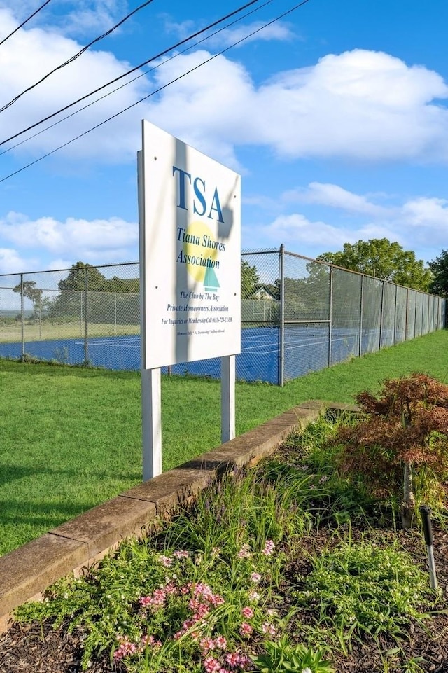 exterior space featuring fence and a lawn