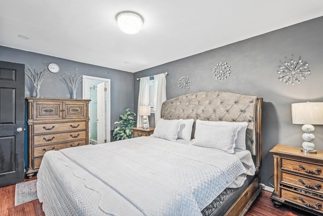 bedroom with dark wood-type flooring