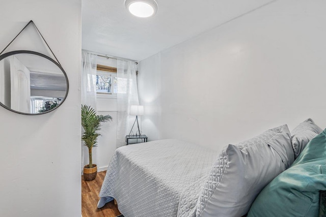bedroom featuring wood finished floors