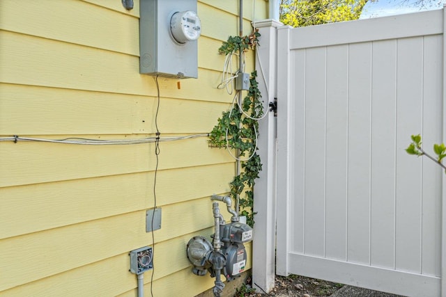 exterior details featuring gas meter and electric meter
