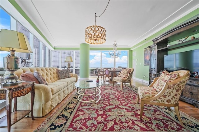 sunroom / solarium with a notable chandelier