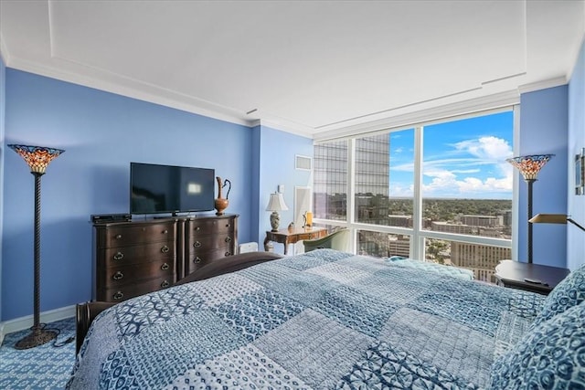 bedroom featuring a wall of windows, carpet flooring, ornamental molding, and baseboards