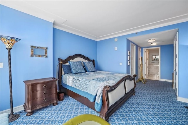 bedroom with carpet and baseboards
