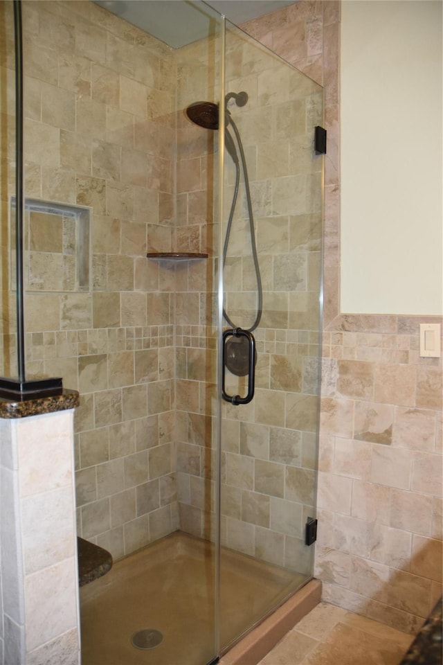 bathroom with a shower stall