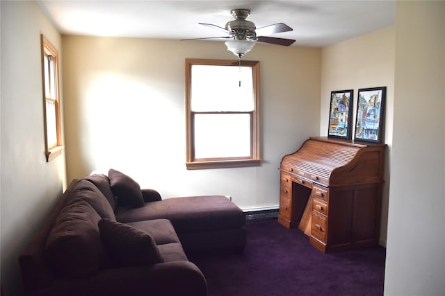 sitting room featuring a ceiling fan and dark carpet
