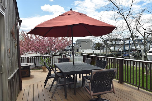 wooden deck featuring outdoor dining area