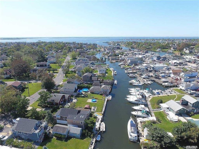 birds eye view of property with a residential view and a water view