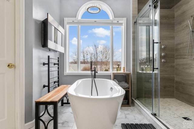 67 Latham Cir, Saugerties, NY 12477 - full bath featuring a stall shower, marble finish floor, and a freestanding tub
