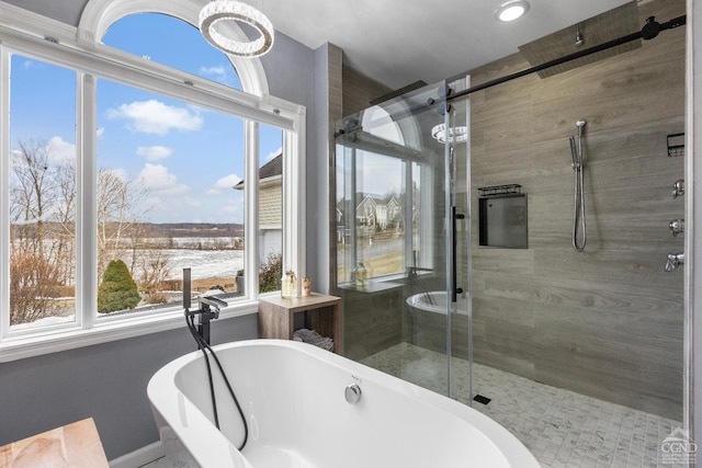 67 Latham Cir, Saugerties, NY 12477 - bathroom featuring a soaking tub, baseboards, and a stall shower