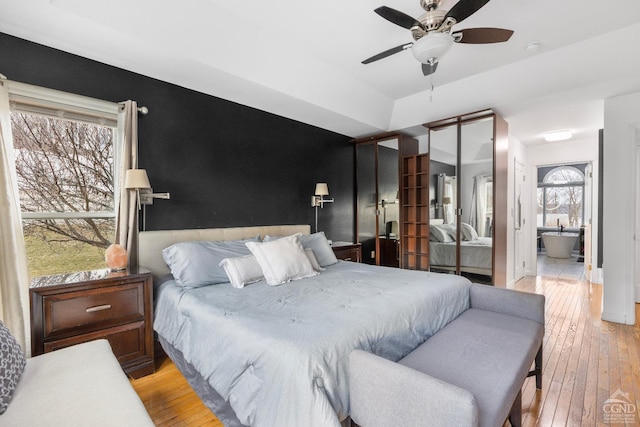 67 Latham Cir, Saugerties, NY 12477 - bedroom with light wood finished floors and ceiling fan