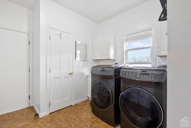 67 Latham Cir, Saugerties, NY 12477 - laundry area with washer and clothes dryer, cabinet space, and light tile patterned floors