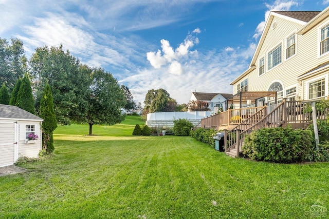 67 Latham Cir, Saugerties, NY 12477 - view of grassy yard featuring a deck, stairway, and a shed