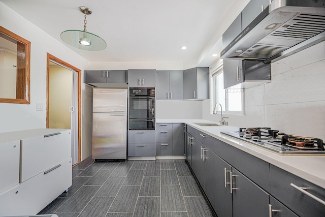 366 Neal Dow Ave, Staten Island, NY 10314 - kitchen with gray cabinetry, stainless steel appliances, a warming drawer, exhaust hood, and a sink