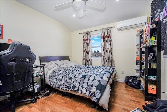 366 Neal Dow Ave, Staten Island, NY 10314 - bedroom with wood finished floors, vaulted ceiling, a wall mounted air conditioner, recessed lighting, and ceiling fan