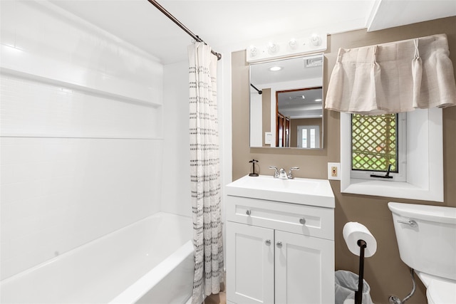 full bathroom with visible vents, toilet, shower / bath combination with curtain, and vanity