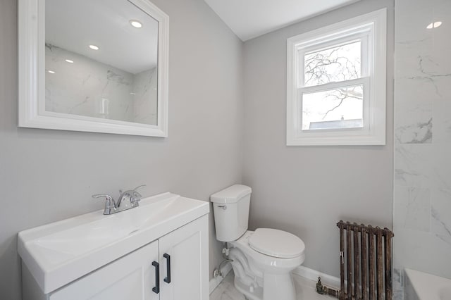 bathroom featuring a washtub, marble finish floor, radiator heating unit, toilet, and vanity