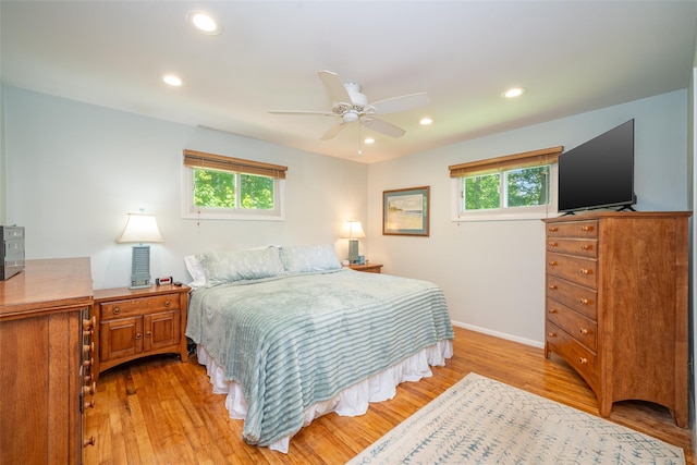 bedroom featuring light wood-style flooring, recessed lighting, baseboards, and a ceiling fan