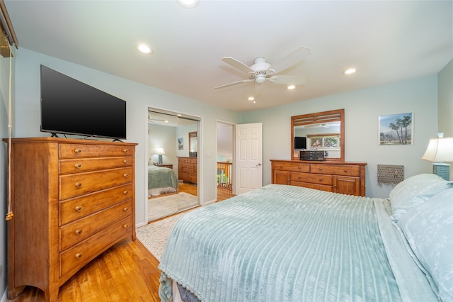 bedroom featuring light wood-type flooring, recessed lighting, a ceiling fan, and a closet
