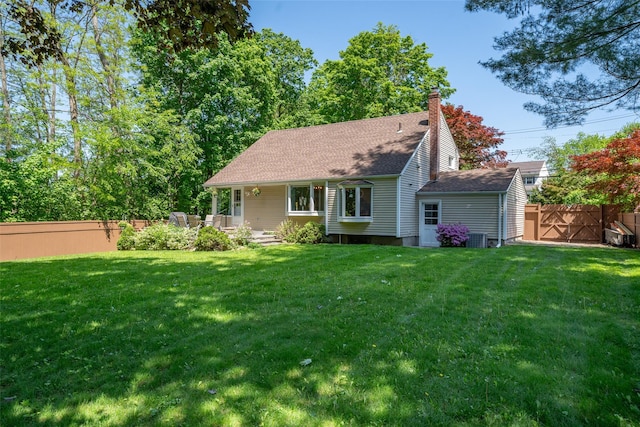 view of front of property with a chimney and a shingled roof