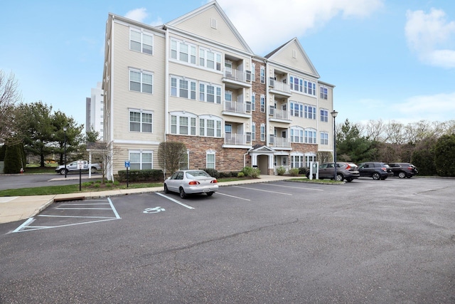 view of property with uncovered parking