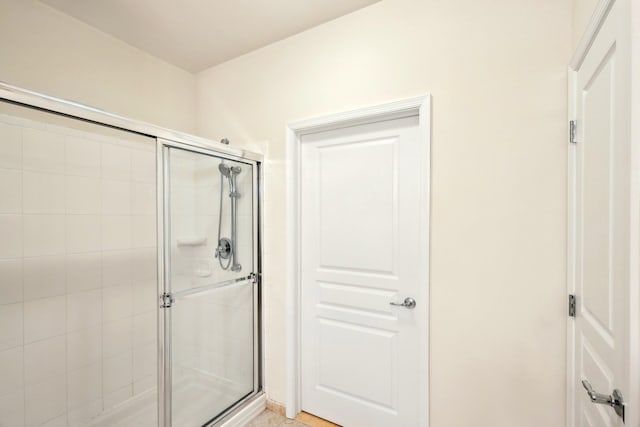 bathroom with a shower stall
