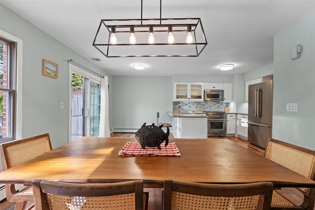 110 Gedney St, Nyack, NY 10960 - dining space featuring baseboard heating and a chandelier