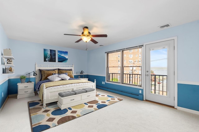 110 Gedney St, Nyack, NY 10960 - bedroom with a baseboard heating unit, access to exterior, carpet floors, and ceiling fan