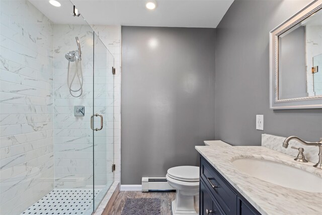 110 Gedney St, Nyack, NY 10960 - full bath featuring a baseboard heating unit, a stall shower, vanity, recessed lighting, and wood finished floors