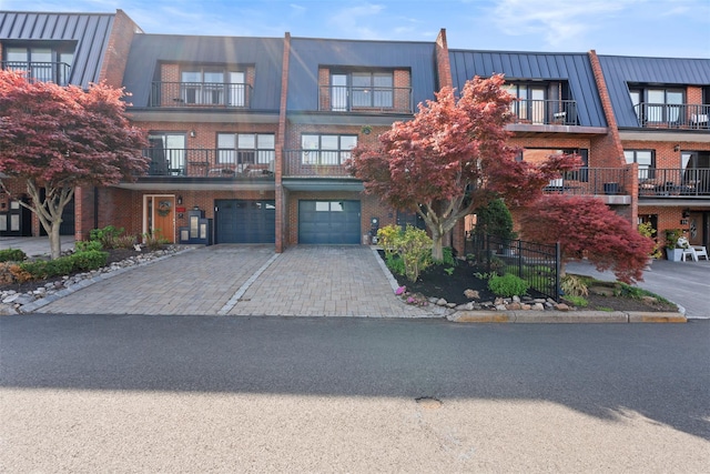 110 Gedney St, Nyack, NY 10960 - view of front facade with a garage, driveway, and brick siding