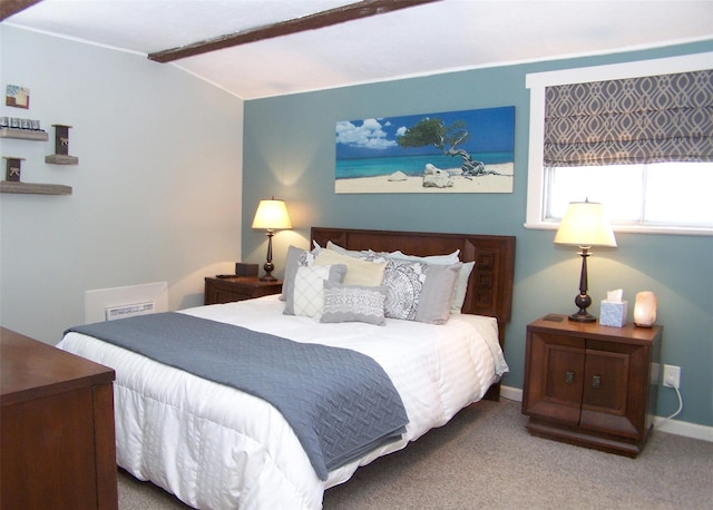 bedroom featuring carpet floors, baseboards, visible vents, and vaulted ceiling