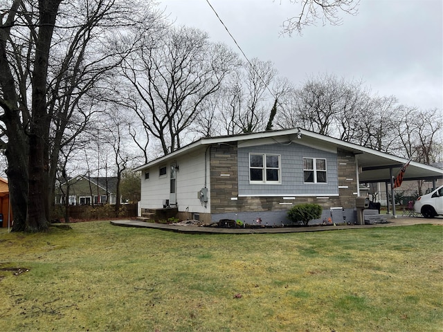 76 Samuel St, Ronkonkoma, NY 11779 - view of property exterior featuring a carport and a lawn