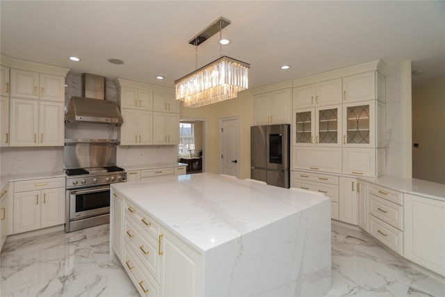 13 Orr-Hatch Dr, Cornwall, NY 12518 - kitchen featuring appliances with stainless steel finishes, wall chimney exhaust hood, recessed lighting, light stone counters, and a kitchen island