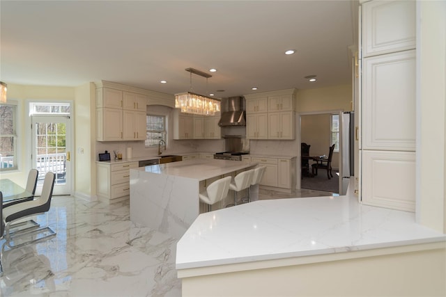 13 Orr-Hatch Dr, Cornwall, NY 12518 - kitchen featuring wall chimney range hood, recessed lighting, light stone countertops, a peninsula, and a kitchen island