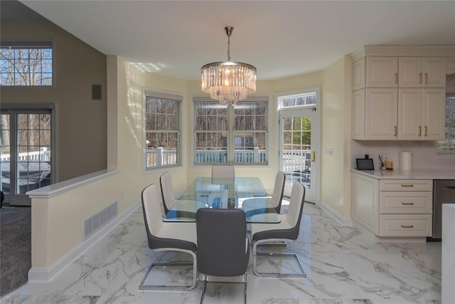 13 Orr-Hatch Dr, Cornwall, NY 12518 - dining area featuring a chandelier, healthy amount of natural light, baseboards, and light marble finish flooring