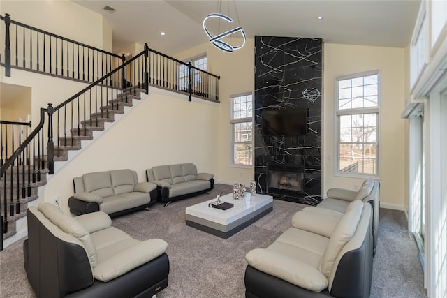 13 Orr-Hatch Dr, Cornwall, NY 12518 - carpeted living area with high vaulted ceiling, stairs, a premium fireplace, baseboards, and recessed lighting
