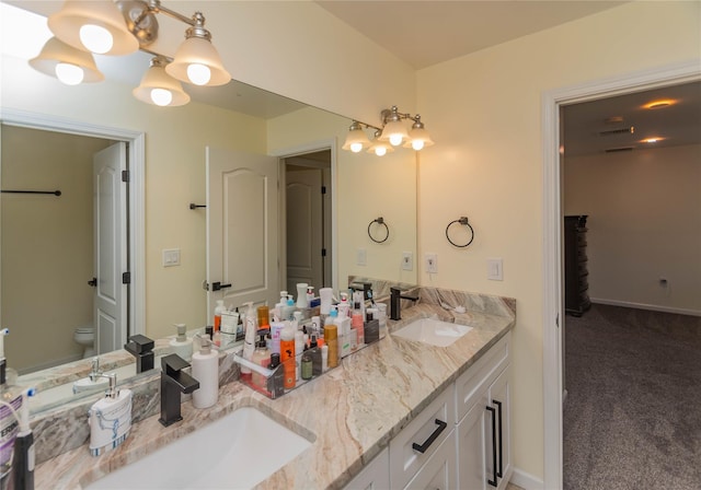13 Orr-Hatch Dr, Cornwall, NY 12518 - bathroom with double vanity, toilet, and baseboards