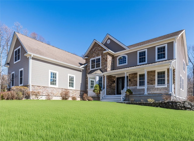 13 Orr-Hatch Dr, Cornwall, NY 12518 - view of front of property with stone siding, a porch, and a front yard
