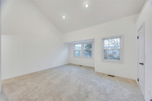 unfurnished bedroom with visible vents, recessed lighting, high vaulted ceiling, and carpet floors