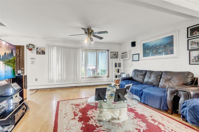living room featuring wood finished floors, ceiling fan, and a baseboard heating unit