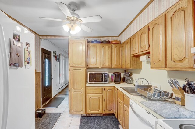 kitchen featuring stainless steel microwave, light countertops, white dishwasher, a ceiling fan, and light tile patterned floors